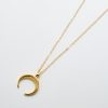 Halsband av halvmåne i guld