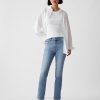 Vintage smala jeans med delad fåll i medelhög höjd