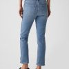 Vintage smala jeans med delad fåll i medelhög höjd